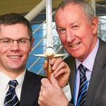 Sharp practice: Planning minister Derek Mackay (left) presents the sword to Gerry Ralph, the college’s senior instructor.