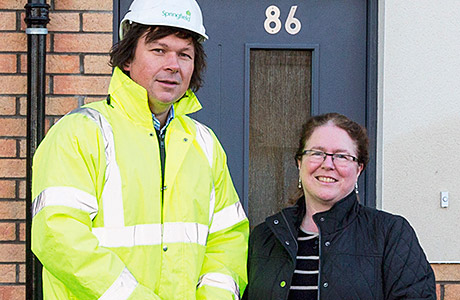 Dave Main hands the keys to Brenda Tonner.