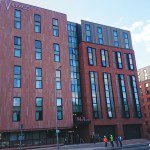 Stone cladding that wraps student flats in local heritage
