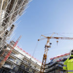 MP won’t back down in cash retentions campaign site with cranes and scaffolding
