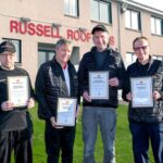 Long-serving Russell Roof Tiles team members presented with woodland