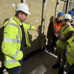 Will Rudd appoints new director at Glasgow practice Andrew Yule on site with University of Glasgow students, showing them around the Lorne Hotel in Glasgow