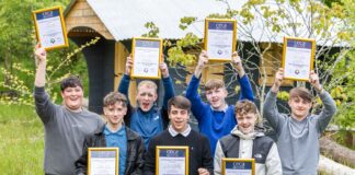 Students holding up their certificates