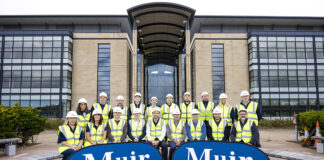 Construction workers in front of Edinburgh office building