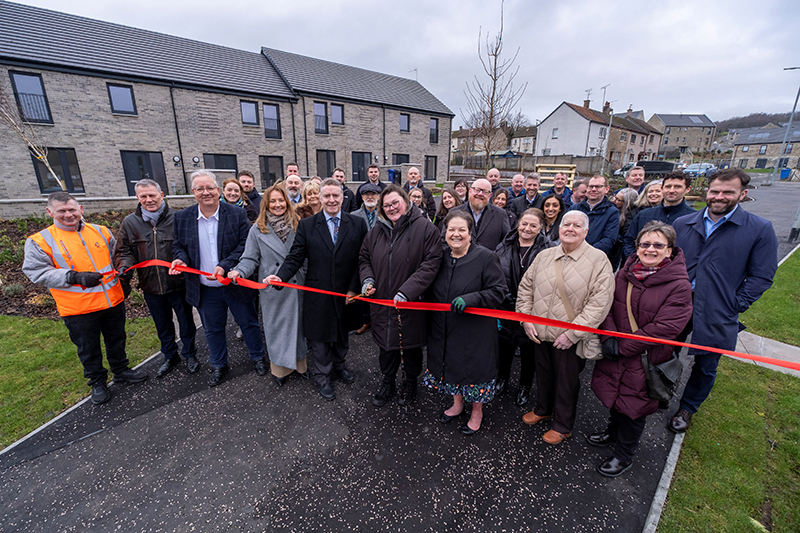 Ribbon cutting at new housing project