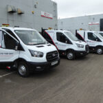 Housing contractor drives sustainability goals with upgraded vans Fleet of vans parked up in a row