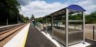 View of platform with seating area and tracks
