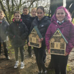 Housebuilder installs bug hotels and wildlife garden at Kennoway school School pupils with bug hotels