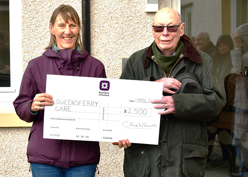 Gillian Smith (QCCC) and Ian Crawford (Manor Estates) with big cheque handover