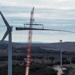 Landmark turbine blades arrival marks ‘defining moment’ for Mill Rig Wind Farm Blade is fitted to a turbine at Mill Rig Wind Farm