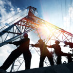 CPA downgrades construction output forecast as Middle East impact begins to bite silhouette workers on background of construction
