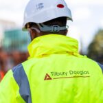 Tilbury Douglas grows order book to £1.7 billion in first half of 2026 Construction worker with Tilbury Douglas jacket