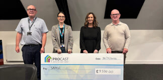 Large cheque being handed over following charity golf day