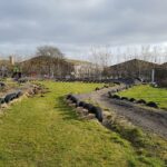 Pupils help contractors in project to turn disused BMX track into garden
