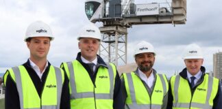 Construction workers at PBSA topping out ceremony