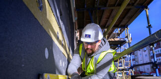 Construction worker carrying out retrofit work
