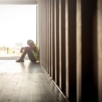 Lighthouse Charity and Ripple Suicide Prevention launch partnership Stressed despair staff in logistic business sittng in container box at shipyard