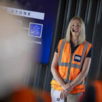 Delivering Growth in Scotland women in hi-vis vest